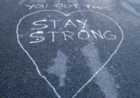 'You Got This - Stay Strong' written on road surface