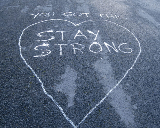 'You Got This - Stay Strong' written on road surface