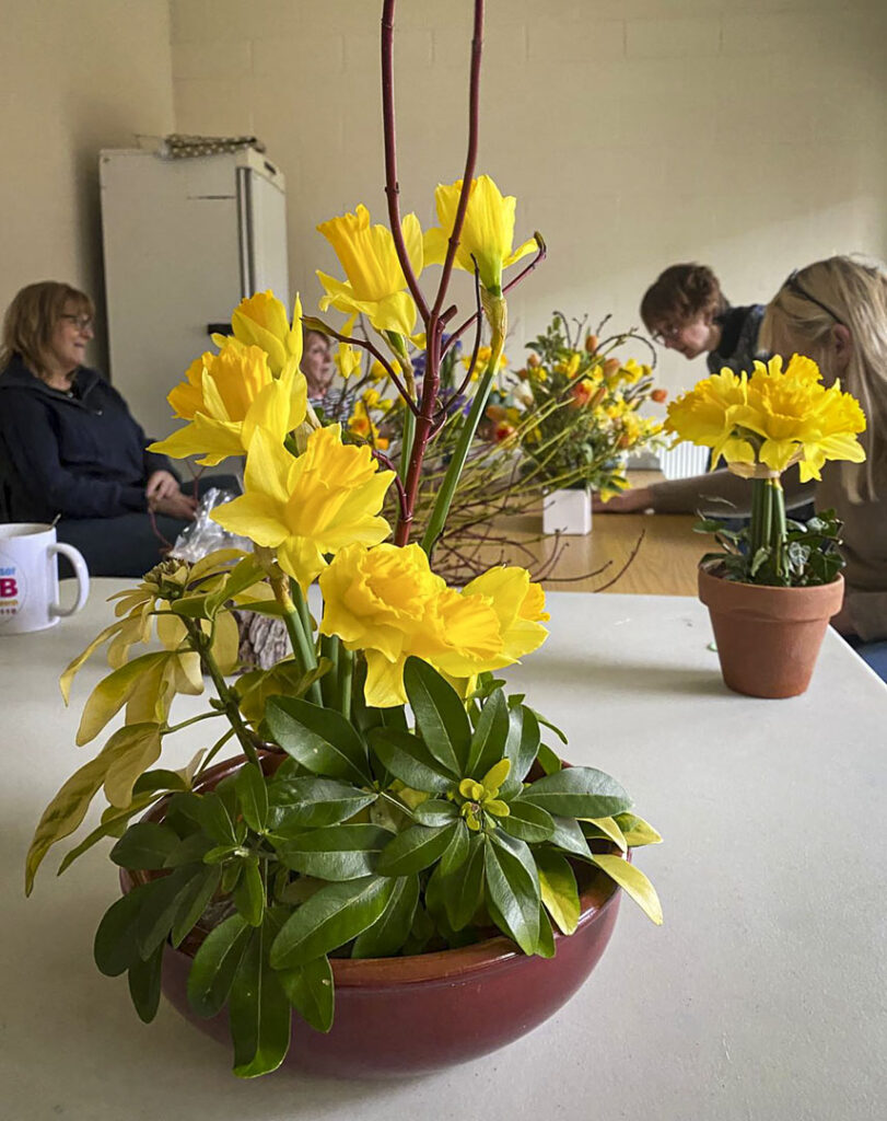 Photo of arranged flowers on table top