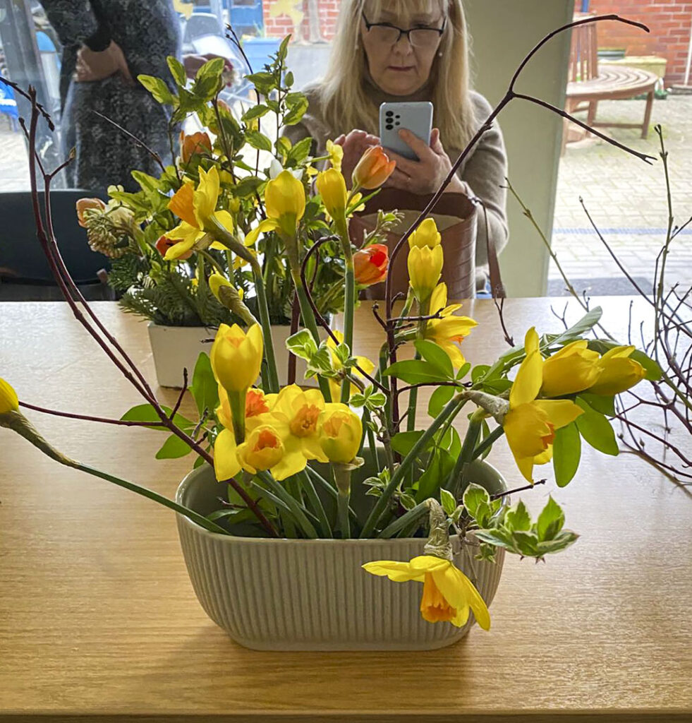 Photo of arranged flowers on table top