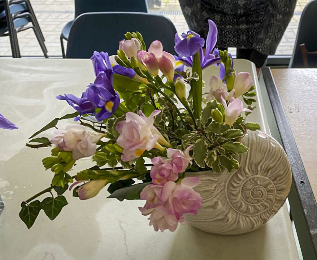 Photo of arranged flowers on table top