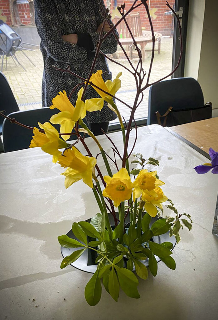 Photo of arranged flowers on table top