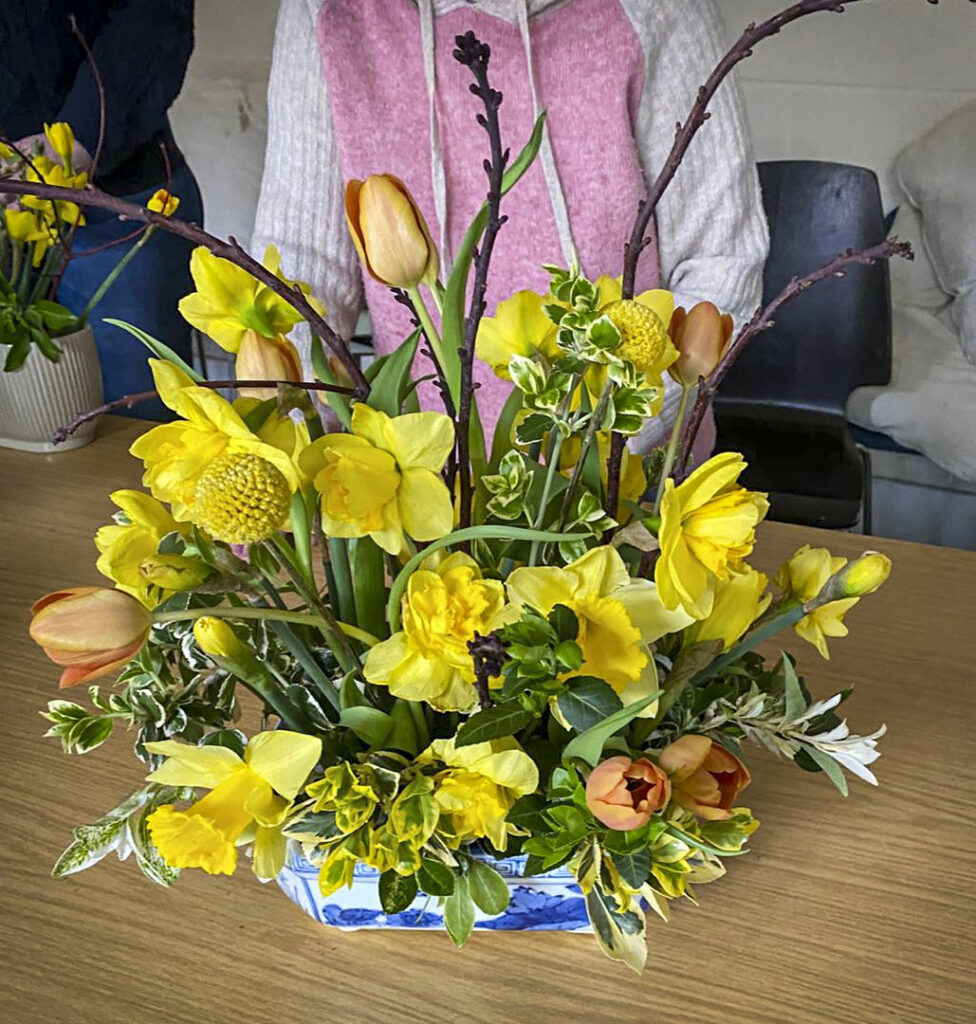 Photo of arranged flowers on table top