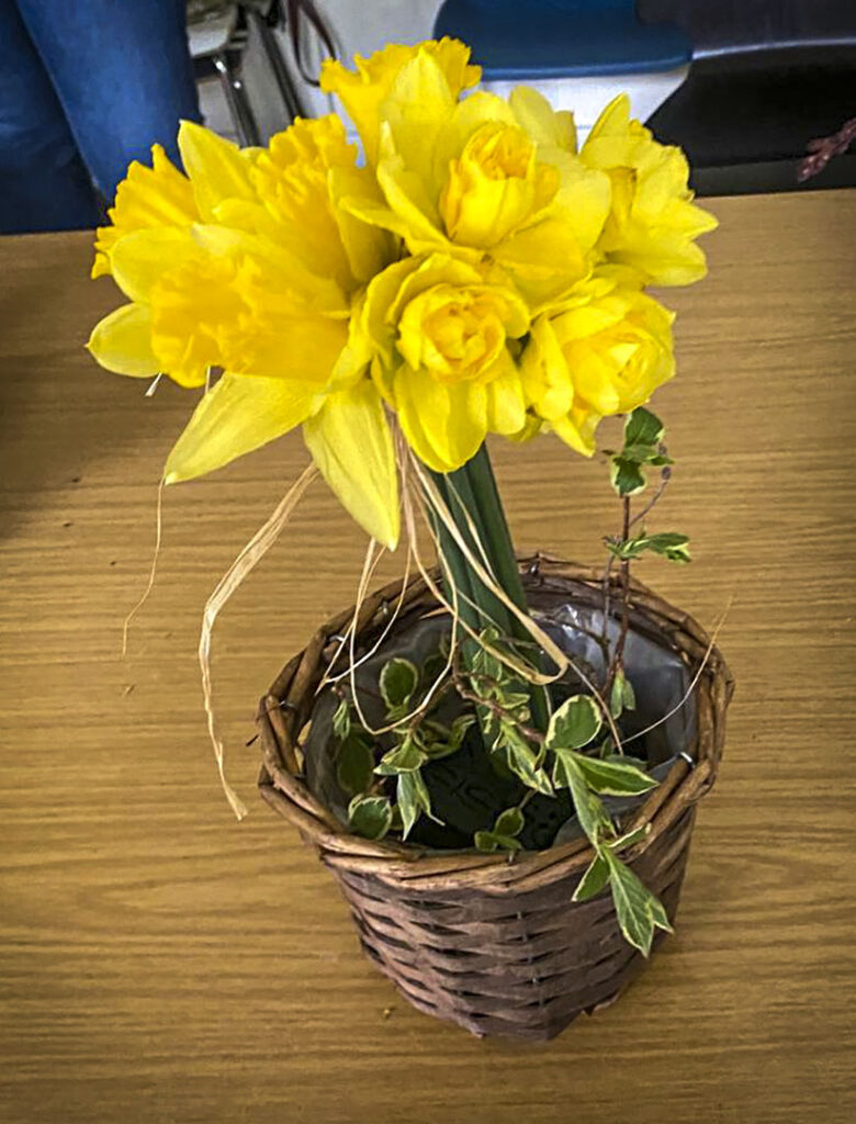 Photo of arranged flowers on table top