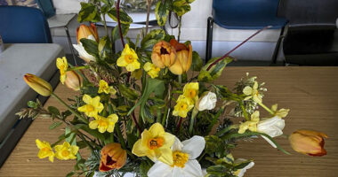 Photo of arranged flowers on table top