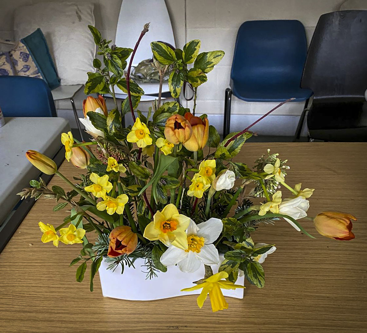 Photo of arranged flowers on table top