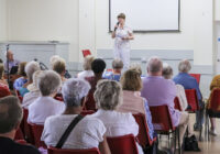 Author Bobbie Darbyshire addressing members at the August 2024 Monthly Meeting